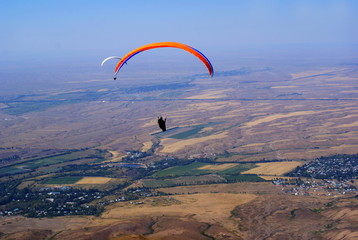 a flight paragliders in summer in Kazakhstan