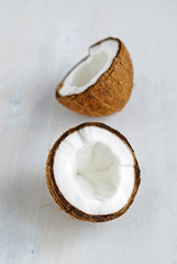 Ripe cracked coconut on grey background