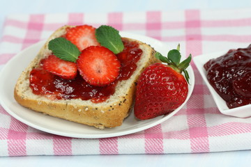Sandwiches with jam and strawberries.
