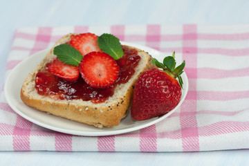 Sandwiches with jam and strawberries.
