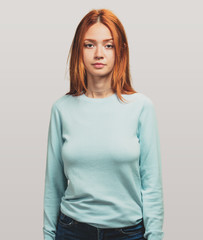 portrait of a pretty redhead girl standing