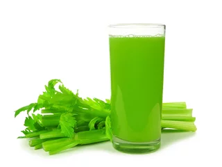 Gordijnen Healthy celery juice in a tall glass isolated on a white background. © Jenifoto