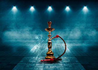 Hookah smoking on the background of an empty brick wall and concrete floor. Spotlight, neon light, smoke