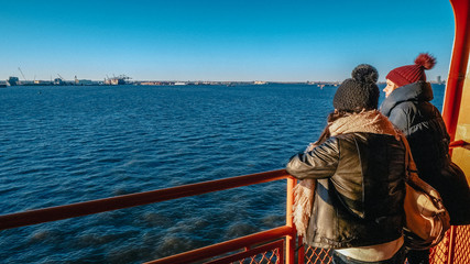 Two young women on a ferry in New York