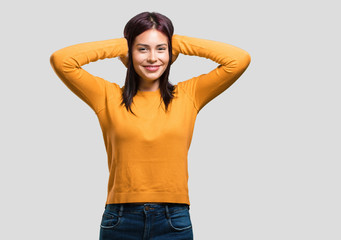 Young pretty woman covering ears with hands, angry and tired of hearing some sound