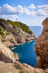 Scenic cove with Capdepera Lighthouse in distance, Mallorca, Spain. 