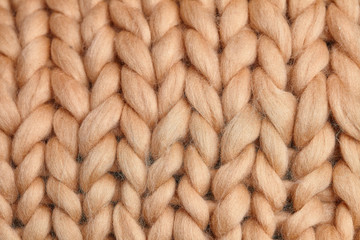 Merino wool handmade knitted large blanket, super chunky yarn, trendy concept. Close-up of knitted...