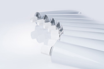 Close up of aluminum tube isolated on white background. Cosmetic or medicine gel.