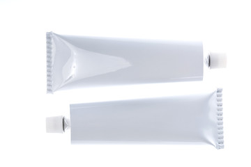 Close up of aluminum tube isolated on white background. Cosmetic or medicine gel.