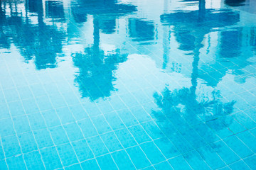 Hotel swimming pool with sunny reflections
