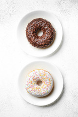 Donuts in chocolate and icing. International Women's Day