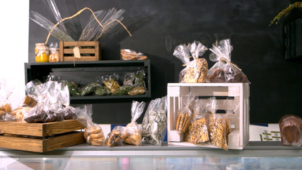 Organic bakery products on table. Modern bakery with assorted baked goods on counter. Healthy...