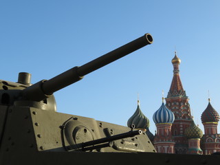 Russian army, tank gun against the St. Basil's Cathedral on Red square in Moscow during military...
