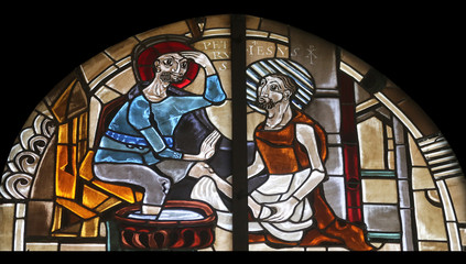 Fototapeta na wymiar Scenes from the life of St. Peter, stained glass window in the parish church of St. Peter and Paul in Oberstaufen, Germany