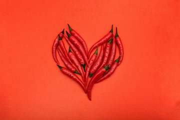 heart of hot red pepper on red