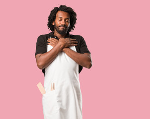 Handsome african american baker proud and confident, pointing fingers, example to follow, concept...