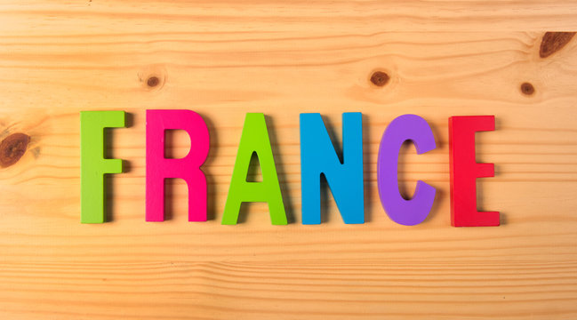 Word France on wooden background