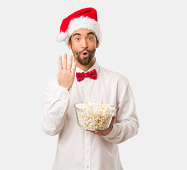 Young man wearing a santa claus hat on Christmas day