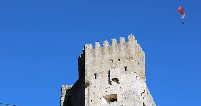 Castle Of Roquebrune-Cap-Martin With Paragliding In The Blue Sky, Old French Medieval Village In France Between Monaco And Menton. French Riviera, Europe - DCi 4K Video