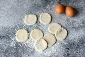 Preparation dough and production of circles from dough for preparation of dumplings with a stuffing. It can be used as a background