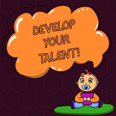 Fototapeta premium Text sign showing Develop Your Talent. Conceptual photo improve natural aptitude or skill with effort and time Baby Sitting on Rug with Pacifier Book and Blank Color Cloud Speech Bubble