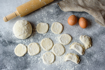 Preparation dough and production of circles from dough for preparation of dumplings with a stuffing. It can be used as a background