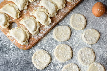 Preparation dough and production of circles from dough for preparation of dumplings with a stuffing. It can be used as a background