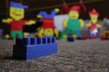 block against the background of toys, kindergarten