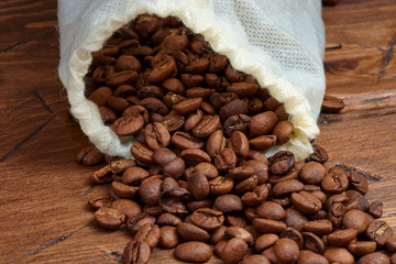 coffee beans on a wooden background scattered