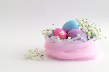 Easter color painted eggs on a white background.