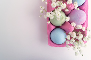 Easter color painted eggs on a white background.