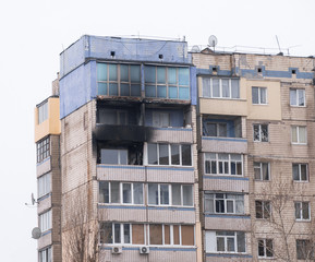 Facade of highrise house after an explosion and fire
