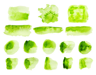 Green watercolor strokes and stains isolated on white background