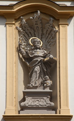 Fototapeta na wymiar Saint Augustine on the facade of St. Augustine's Church in Wurzburg, Germany