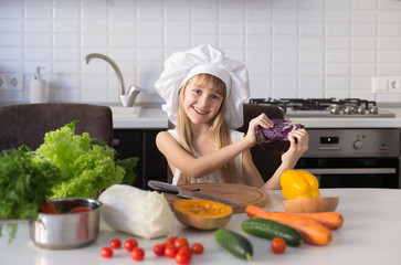  little girl, white chef hat, vegetables
