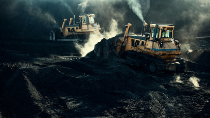 Excavators are working, dirty job, industrial, smoke