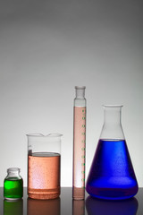 Liquid in laboratory bottles. Scientific biochemical laboratory. Colorful liquid.