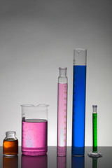 Liquid in laboratory bottles. Scientific biochemical laboratory. Colorful liquid.