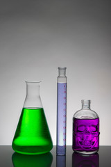 Liquid in laboratory bottles. Scientific biochemical laboratory. Colorful liquid.