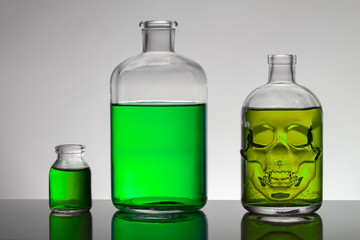 Liquid in laboratory bottles. Scientific biochemical laboratory. Colorful liquid.