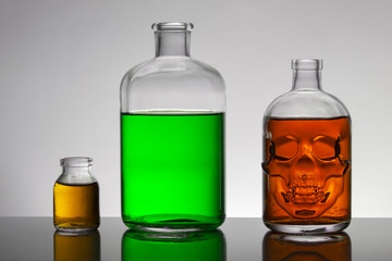 Liquid in laboratory bottles. Scientific biochemical laboratory. Colorful liquid.
