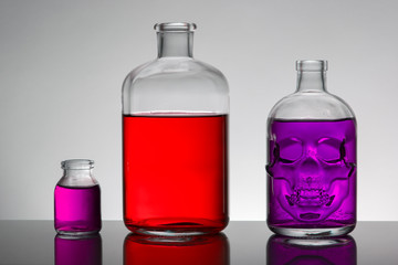 Obraz na płótnie Canvas Liquid in laboratory bottles. Scientific biochemical laboratory. Colorful liquid.