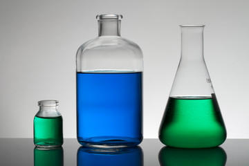 Liquid in laboratory bottles. Scientific biochemical laboratory. Colorful liquid.