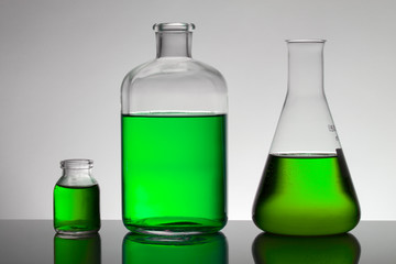 Liquid in laboratory bottles. Scientific biochemical laboratory. Colorful liquid.