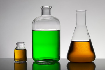 Liquid in laboratory bottles. Scientific biochemical laboratory. Colorful liquid.