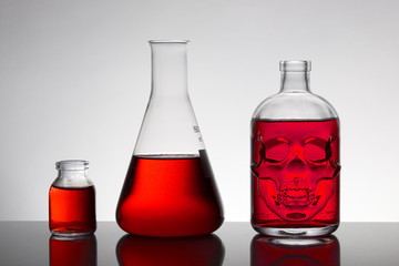 Liquid in laboratory bottles. Scientific biochemical laboratory. Colorful liquid.