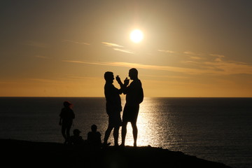Friends on the beacht at sunset