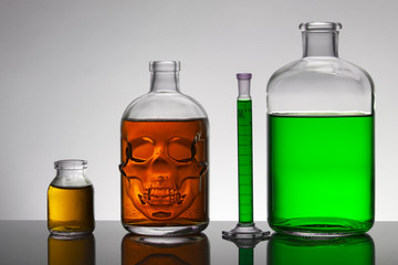 Liquid in laboratory bottles. Scientific biochemical laboratory. Colorful liquid.