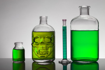 Liquid in laboratory bottles. Scientific biochemical laboratory. Colorful liquid.