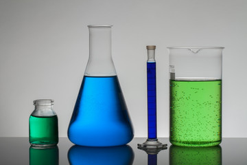 Liquid in laboratory bottles. Scientific biochemical laboratory. Colorful liquid.